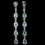 A pair of 925 silver drop earrings set with pear and round cut blue topaz, L. 5cm.