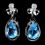 A pair of 925 silver earrings set with large pear cut blue topaz and white stones, L. 2.6cm.