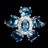 A matching 925 silver flower shaped ring set with London blue topaz and white stones, (N.5).