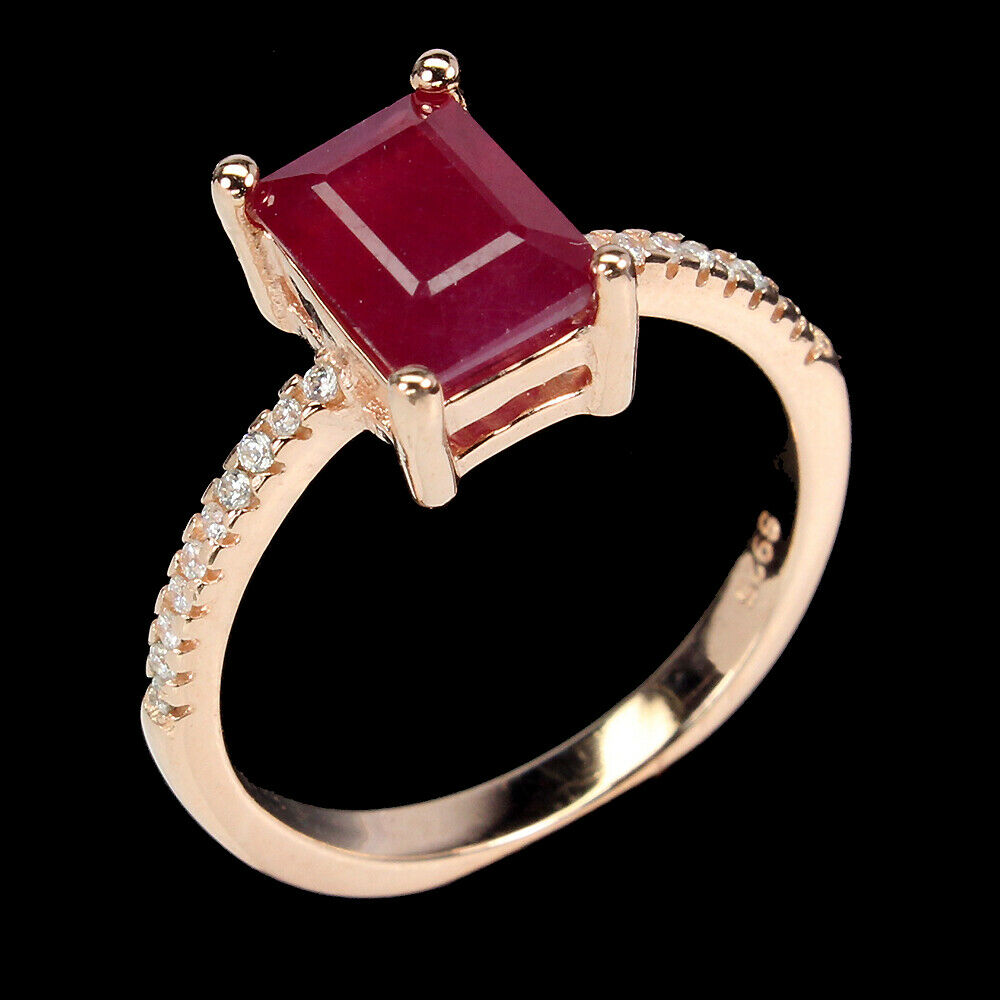 A 925 silver rose gold gilt ring set with a baguette cut ruby and white stone set shoulders, (N). - Image 2 of 2