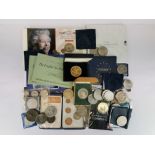 A box of mixed commerative coins.