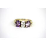 A 9ct yellow gold amethyst and white stone set ring, (P).
