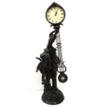 A large Victorian style resin figure holding a clock, H. 84cm.