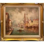 A gilt framed oil on board of Venice signed L.Costello, frame size 77 x 67cm.