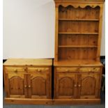 A pine kitchen dresser, 90 x 41 x 200cm. together with a matching pine kitchen cabinet.