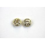 A pair of 9ct yellow gold (stamped 375) stud earrings set with brilliant cut yellow diamonds,