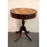 An inlaid chessboard top side table with chess pieces (one white knight and rook missing). King H.