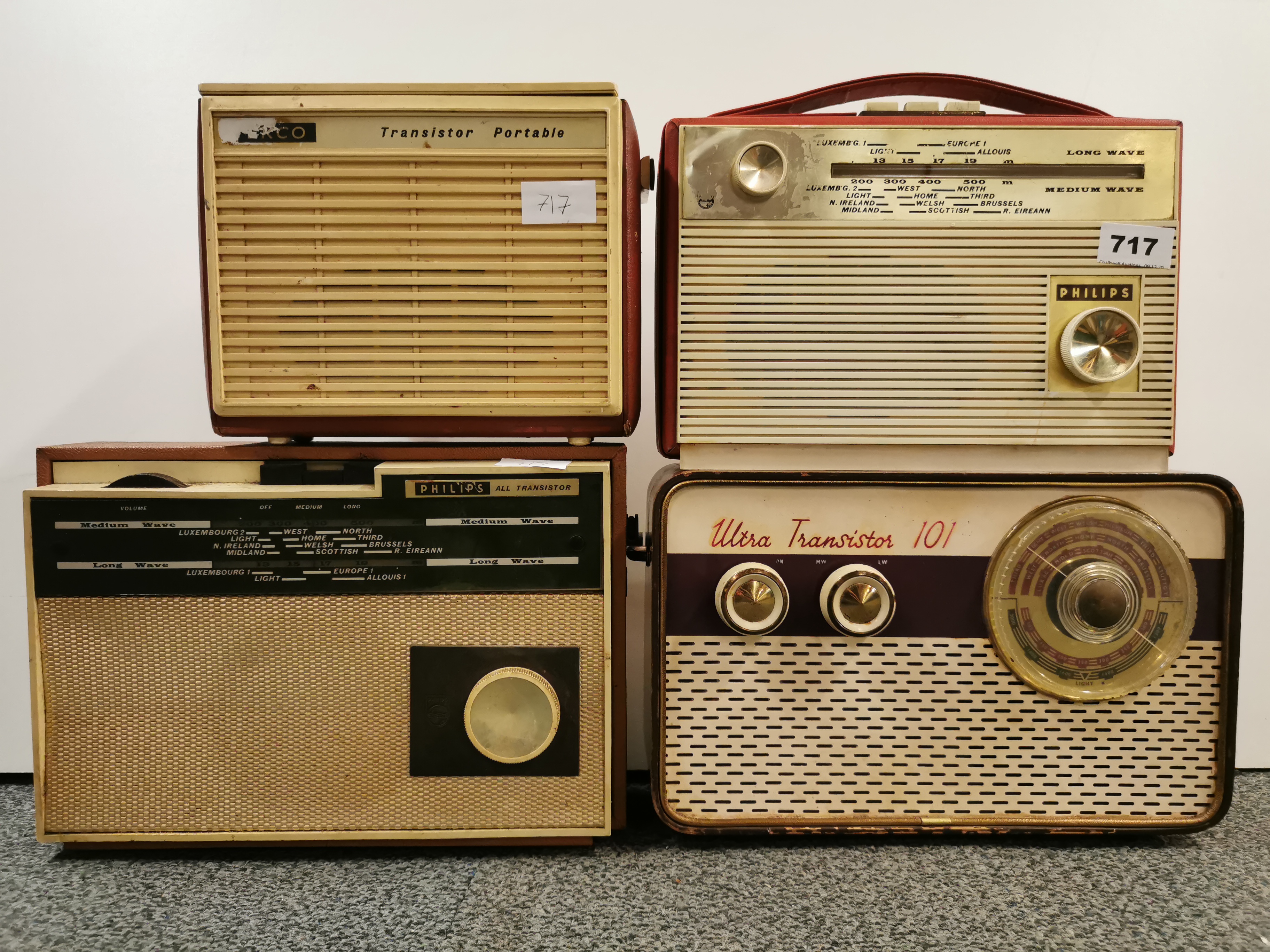 An Ekco portable transistor radios and three other vintage radios.