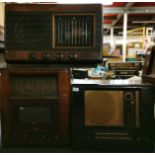 A wooden cased Bush radio type P.B.55, a His Masters Voice radio and a further Camberidge PYE wooden