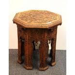 A carved octagonal side table, Dia. 48cm.