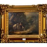 A 19th Century gilt framed oil on canvas of a woman and child with a pony playing with a dog,