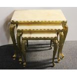 A 1970's nest of three gilt brass and onyx coffee tables, largest 30 x 50 x 44cm.