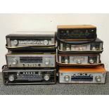 Seven Roberts transistor radios.