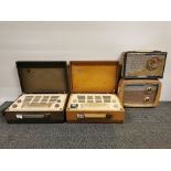 Four vintage cased radios.