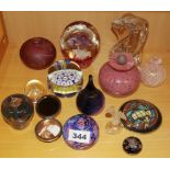 A group of glass paper weights and other items.