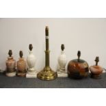 A group of brass onyx and ceramic table lamps, tallest 48cm.