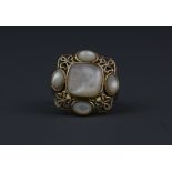 A 9ct yellow gold (stamped 375) mother of pearl set ring, (R).