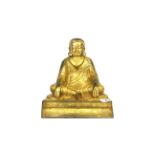 A Tibetan gilt bronze seated Buddhist Deity, H. 19cm.