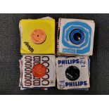 A quantity of 45 RPM single records.