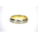 A 9ct yellow gold and platinum wedding band, (R).
