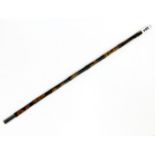 An early 20th Century police 'partridge cane' swagger stick, L. 53cm.