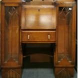 An Art Deco oak bureau book case, W. 120cm.