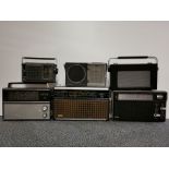 Six vintage transistor radios.