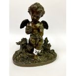 A 19th Century bronze figure of a cherub, H. 21cm.