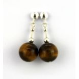 A pair of 95 silver tigers eye drop earrings and matching pendant.