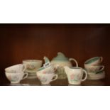 A Susie Cooper tea set with Dresden spray green pattern.