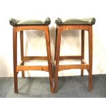 A pair of vintage upholstered stools.