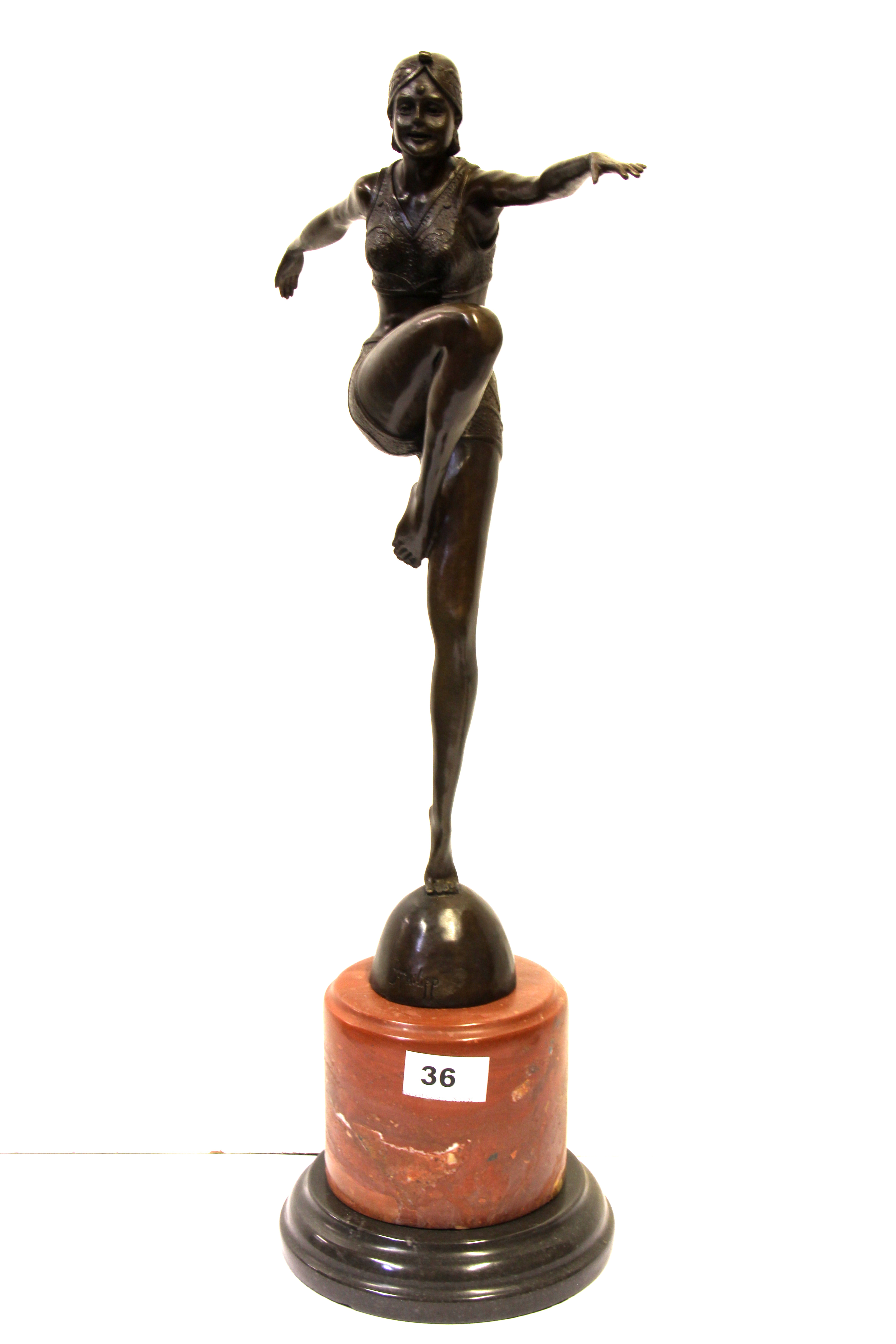 An Art Deco style bronze figure of a female dancer, after J. Philipp (1943 - 2012) on a two tone