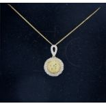 A silver gilt and diamond set pendant and chain.