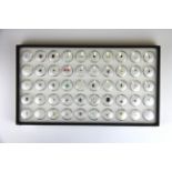 A tray containing over 50 unmounted gemstones, including opal, citrine, ruby, emerald, diamond,