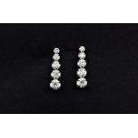 A pair of 18ct white gold (stamped 750) drop earrings set with brilliant cut graduated diamonds,