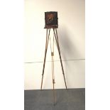 A Thornton-Pickard mahogany plate camera with folding wooden tripod and three mahogany plates.