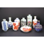 A group of eight Chinese porcelain snuff bottles and one brush washing bowl.