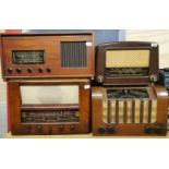 A Cosser bakelite vintage radio and three further wooden cased vintage radios.