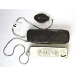 A Minox B Subminiature espionage camera (1958-1969) with a leather case.