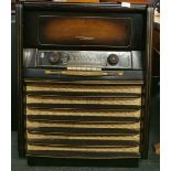 A large wooden cased Grundig Warwick 9062 W/3D AM-FM console.