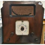 An early Defiant walnut veneered cased vintage radio, W. 51cm. H. 52cm. Condition: front glass is
