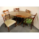 A regency style mahogany extended dining table and a set of five matching dining chairs. Table