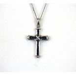 A 9ct white gold sapphire set cross pendant and chain, L. 2.6cm.