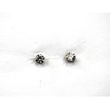 A pair of 900 platinum stud earrings set with brilliant cut diamonds, approx. 0.30ct.