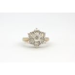 A 9ct yellow and white gold cluster ring set with brilliant cut diamonds, (N),