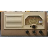 A Good listening Ltd. painted metal cased radio, W. 62cm.