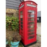 An original British red telephone box. Currently located a short distance from the saleroom and to