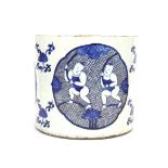 A Chinese hand painted porcelain brush pot with underglaze blue and red decoration with a six