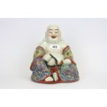 A mid-20th Century Chinese hand enamelled porcelain figure of Putai, H. 20cm.