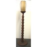 An interesting carved wooden standard lamp, H. 152cm.